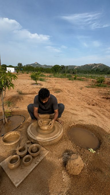 A guest trying pottery on the farm